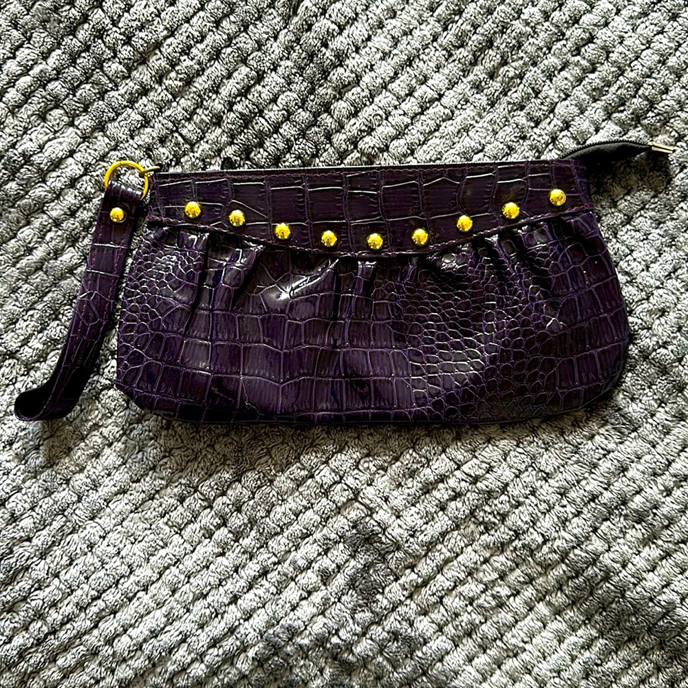 Clutch purple with gold buttons. Just like new!